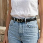 Slim black leather womens belt with a polished silver tone interlocking buckle (2)