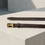 a chocolate brown leather belt with a gold H buckle (6)